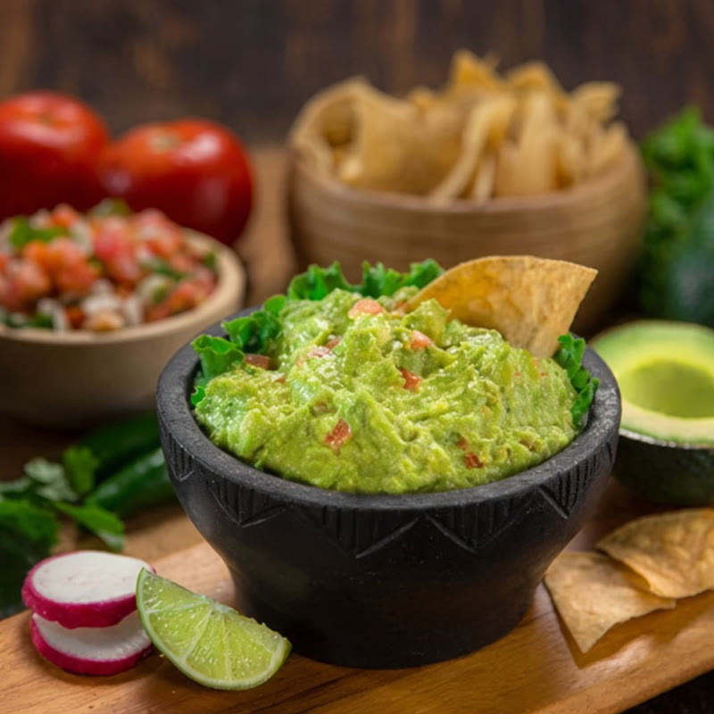 Guacamole served with chips and lime