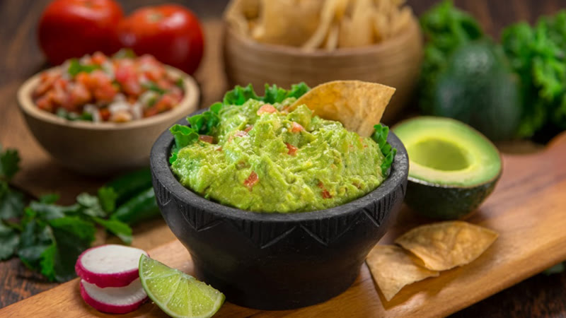 Guacamole appetizer served at the table